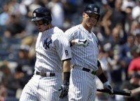 Tyler Austin (left) and Aaron Judge (right) celebrate after Austin hits his first home run.