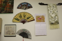 Japanese artifacts decorate the wall behind Osawa-Minevich's desk.